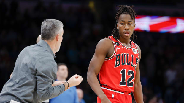 Nov 25, 2022; Oklahoma City, Oklahoma, USA; Chicago Bulls head coach Billy Donovan talks to guard Ayo Dosunmu (12) between plays against the Oklahoma City Thunder during overtime at Paycom Center.
